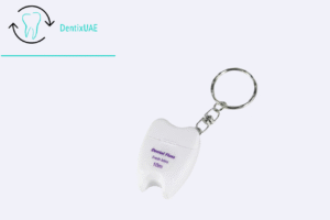 Tooth-shaped dental floss keychain